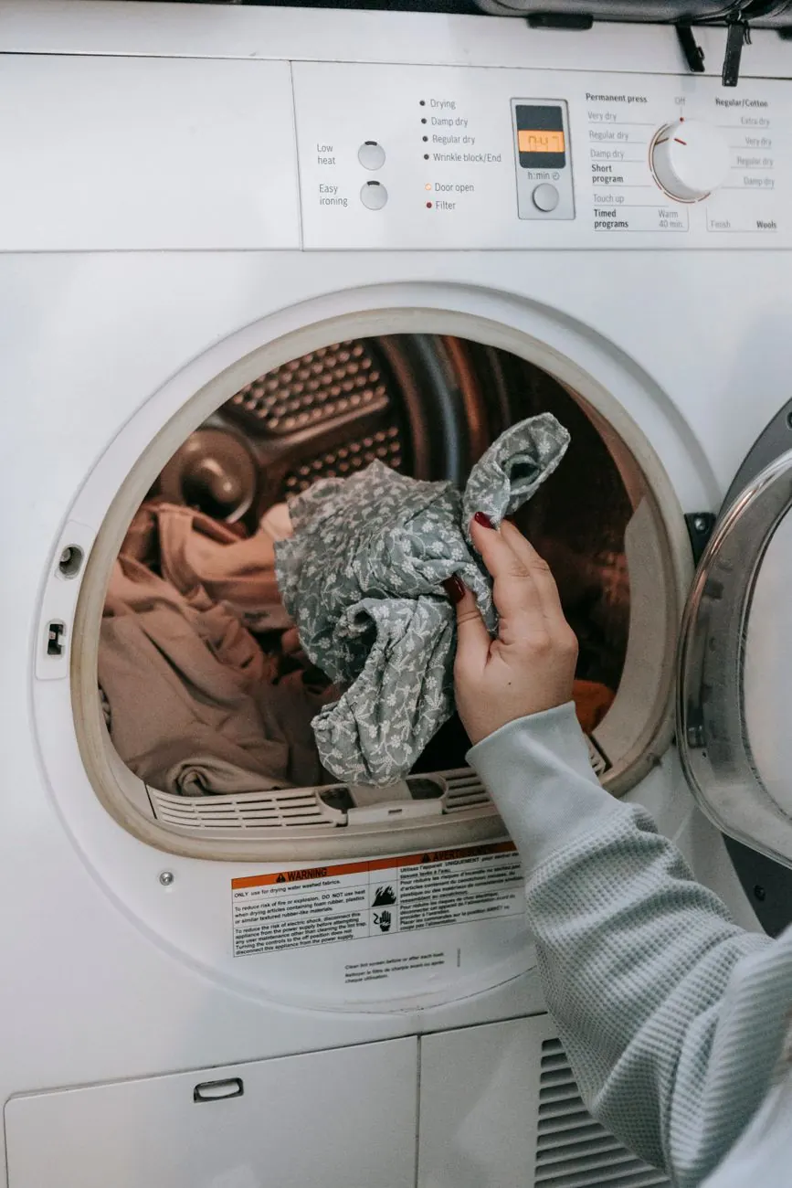 Dryer repair in Decatur - technician replacing a heating element